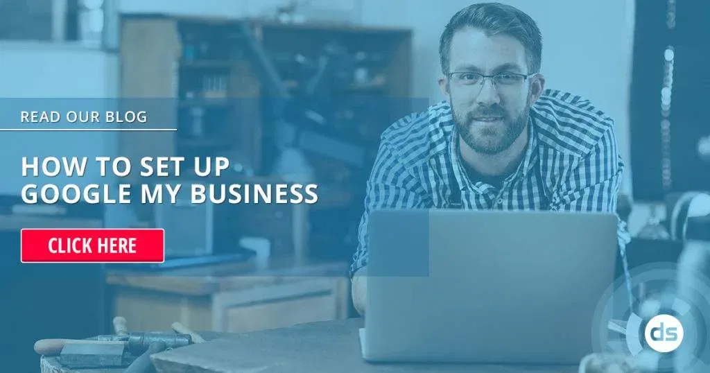 Professional man with glasses working on a laptop in an office setting, with a call-to-action overlay inviting viewers to set up Google My Business by reading a blog.