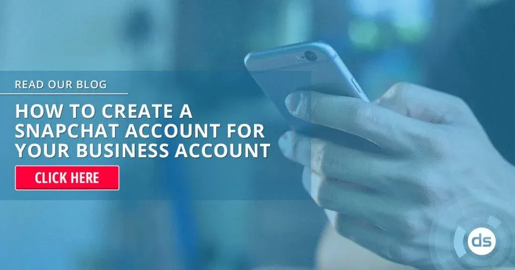 Person holding a smartphone with an online advertisement for creating a Snapchat account for business purposes in the background.