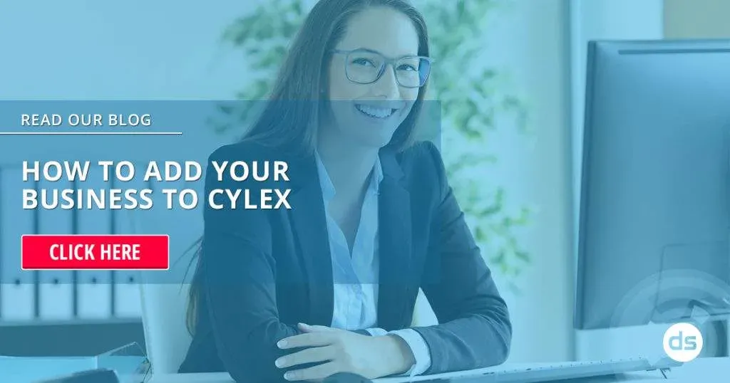 Businesswoman at her desk with a call-to-action to Register Your Business with Cylex by reading a blog about adding a business to Cylex.