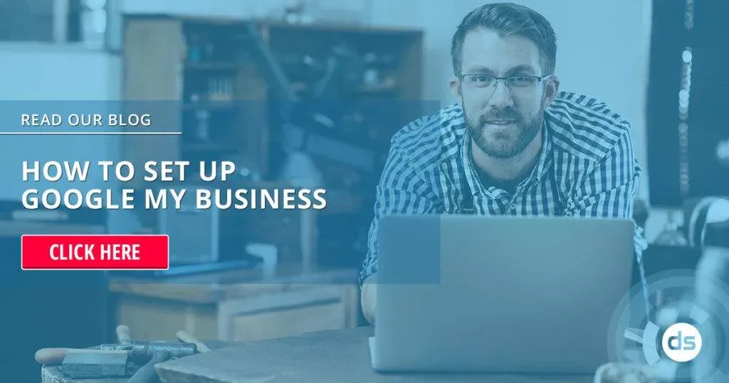 Professional man with glasses working on a laptop in an office setting, with a call-to-action overlay inviting viewers to set up Google My Business by reading a blog.