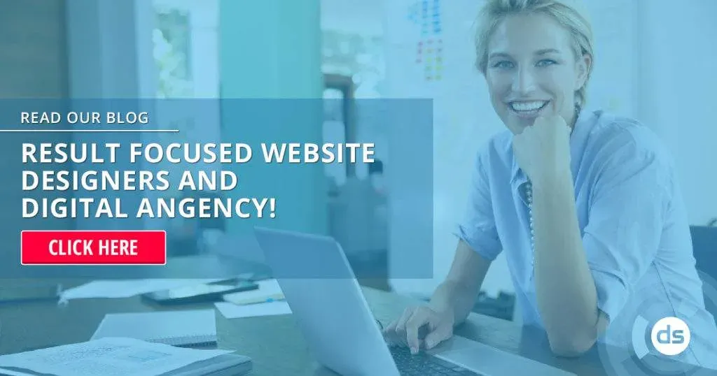 Smiling website designers at a desk with a computer, promoting website design services.