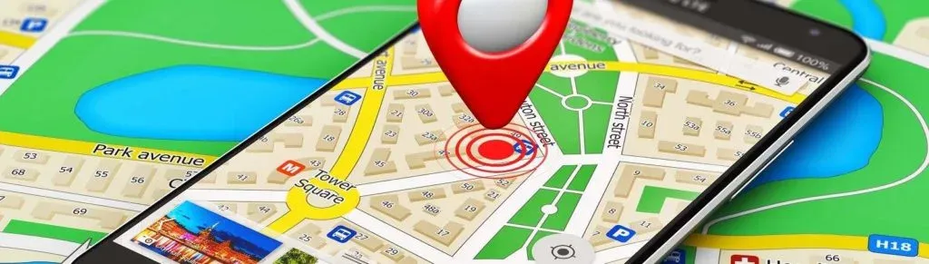 A smartphone displaying a navigation map with a red pin indicating a specific location, optimized for local SEO.
